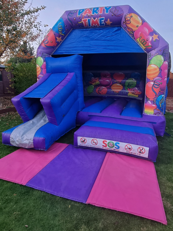 Party Time adult bouncy castle with slide, 5* party hire company, Sussex, Kent, Essex, London